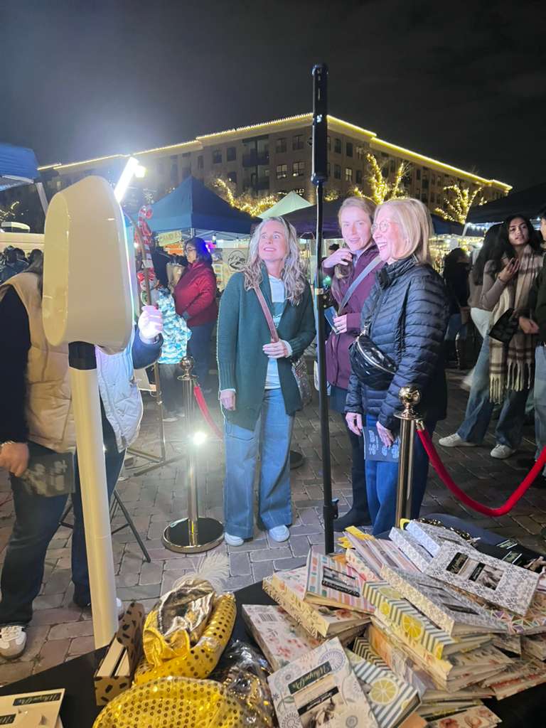 Smiling guests on the booth